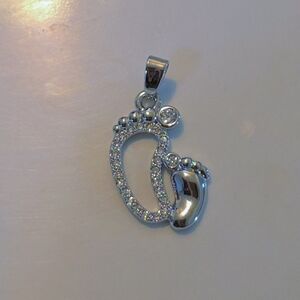 Elegant Silver Footprint Pendant